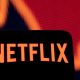 Illustration shows Netflix logo and stock graph