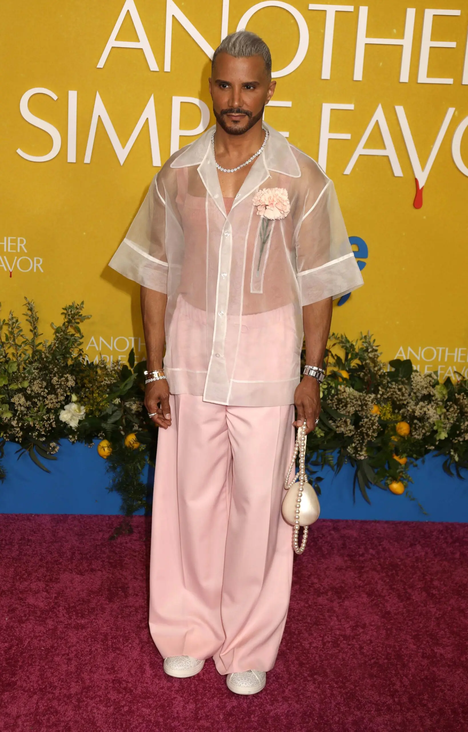 Jay Manuel posing on the red carpet.