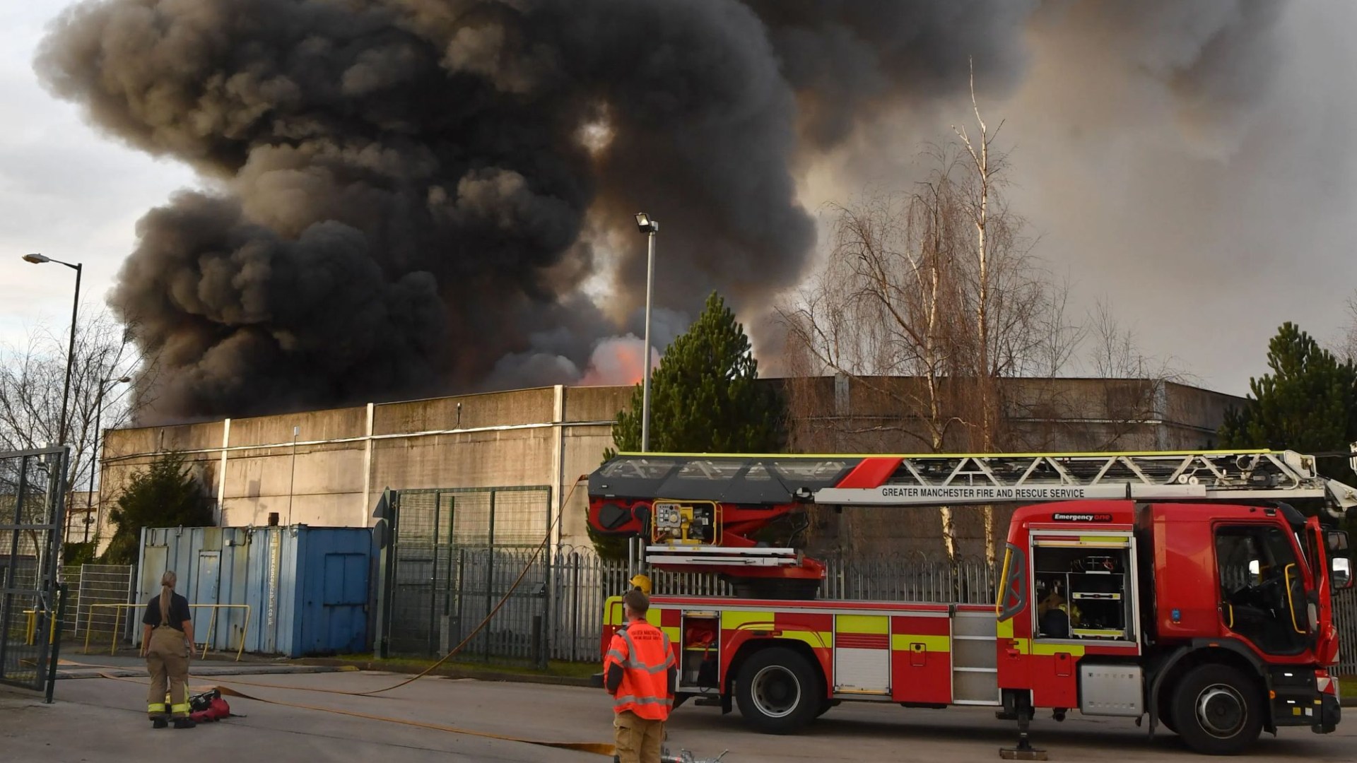 Huge fire engulfs scrap yard as plumes of smoke 'seen for miles' and people urged to avoid the area
