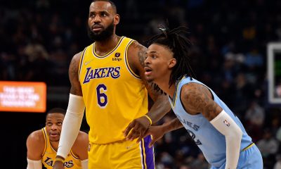 Memphis Grizzlies' Ja Morant guarding Los Angeles Lakers' LeBron James during a regular season game.