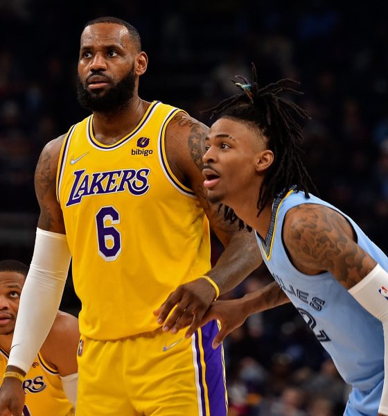 Memphis Grizzlies' Ja Morant guarding Los Angeles Lakers' LeBron James during a regular season game.