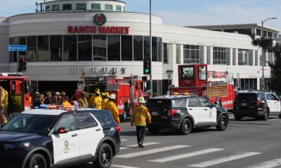 At least three dead and six injured after driver hits cyclist and crashes car into Los Angeles supermarket
