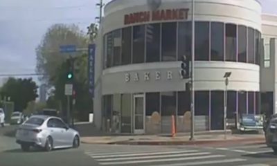 Horror moment car ploughs into shop killing three after driver, 92, hit cyclist and lost control of wheel in Los Angeles