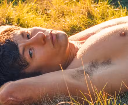 Barry Keoghan's Oliver Quick in Saltburn laying in the grass.