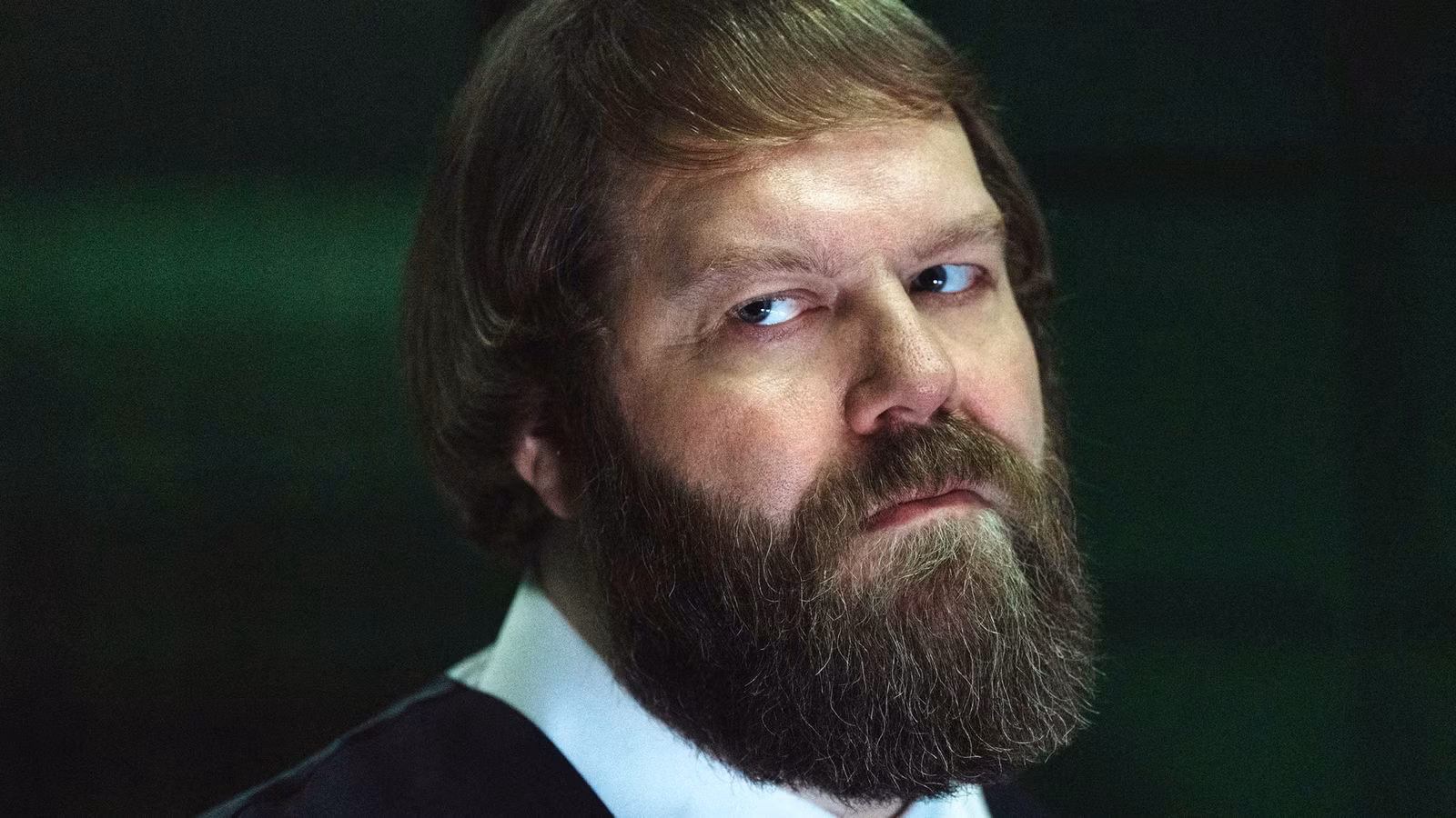 Jon Pack in Severance, looking skeptical