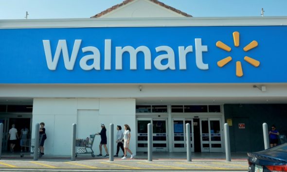 Shares of Walmart rose as it reported higher profits and lifted its forecast