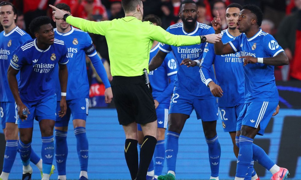 Real Madrid's Vinicius Junior demonstrating with referee Francois Letexier. Pic: Reuters