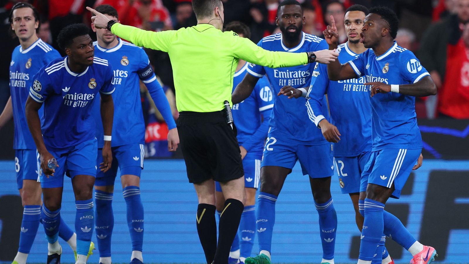 Real Madrid's Vinicius Junior demonstrating with referee Francois Letexier. Pic: Reuters
