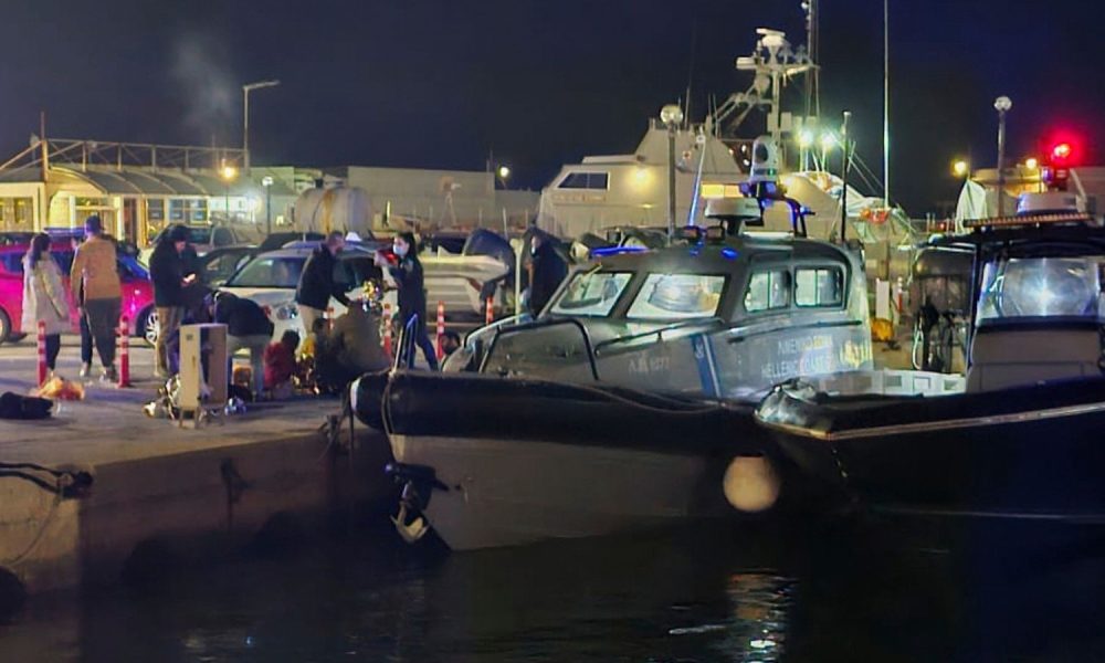 Coast guard officers carry out rescue operations after the collision off the coast of Chios. Pic: AP/Pantelis Fykaris