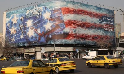An anti-US billboard on a building in Tehran, Iran. Pic: WANA/Reuters