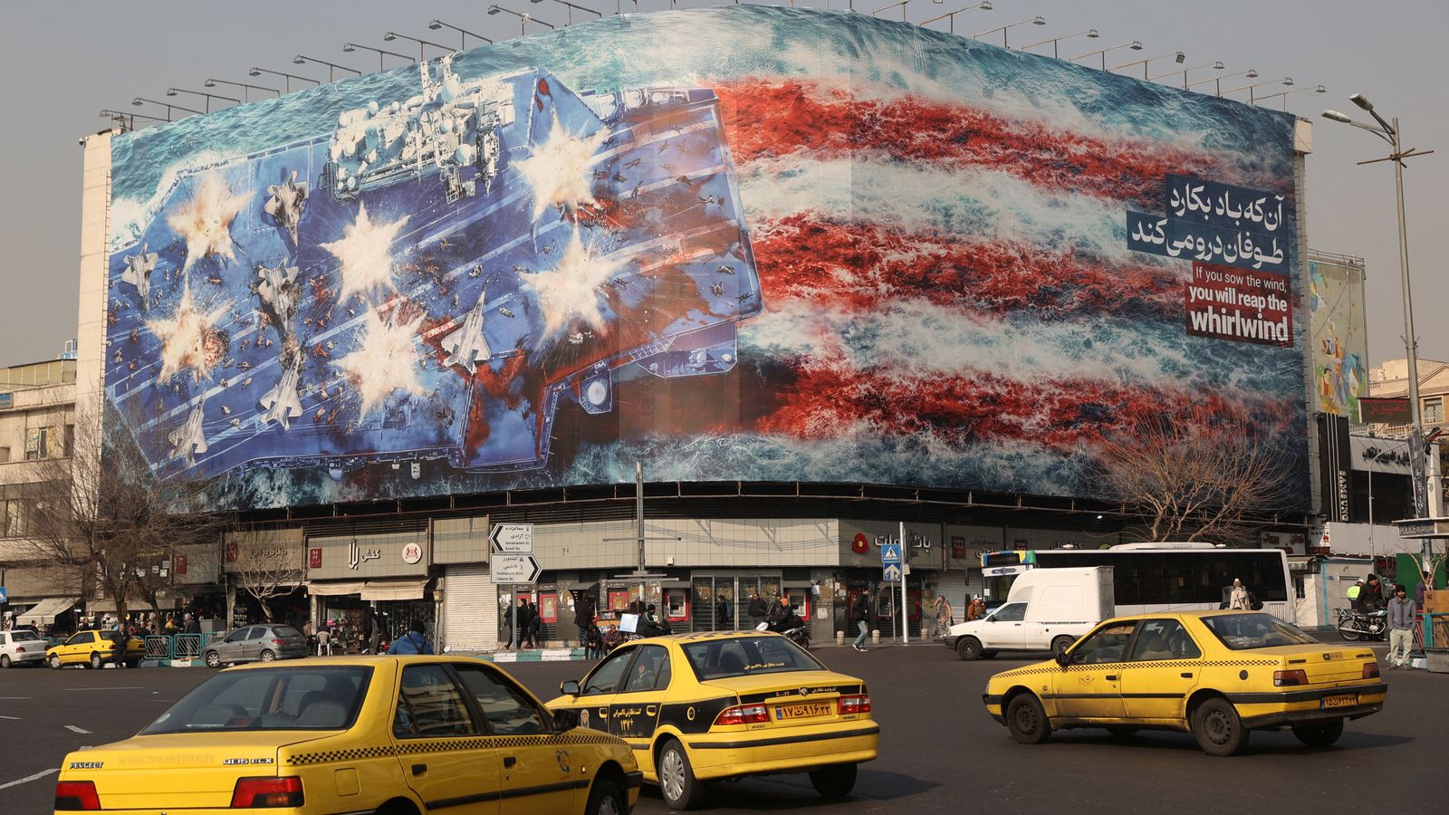 An anti-US billboard on a building in Tehran, Iran. Pic: WANA/Reuters