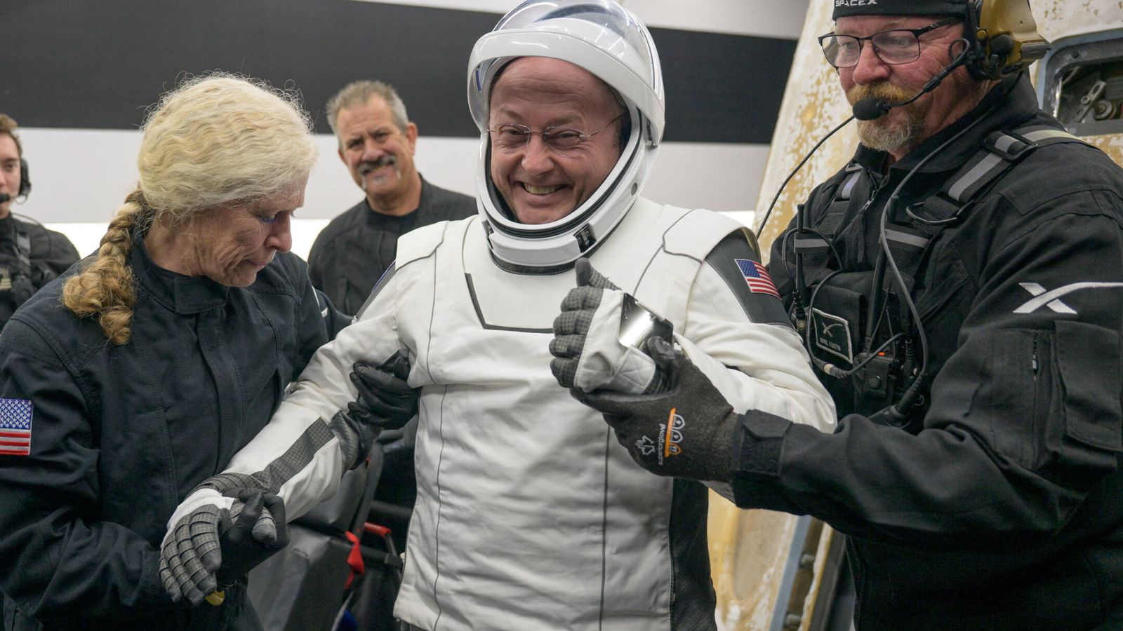 NASA astronaut Mike Fincke was helped out of a spacecraft after returning to Earth in January. Pic: Reuters