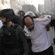 Israeli police detain a man during the protest. Pic: AP
