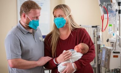 Tobi with parents Jeff Maginnis and Michelle Johnson