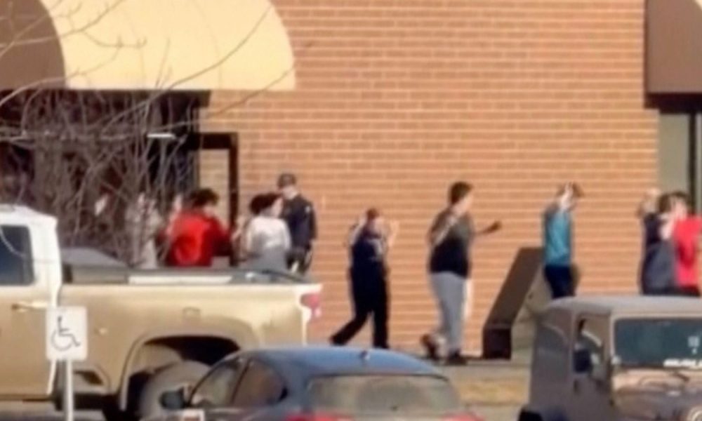 Footage shows students leaving their school with their arms in the air. Pic: AP