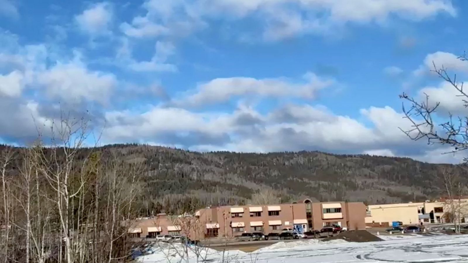 Vehicles are parked outside Tumbler Ridge Secondary School. Pic: Trent Ernst/Tumbler RidgeLines/Reuters