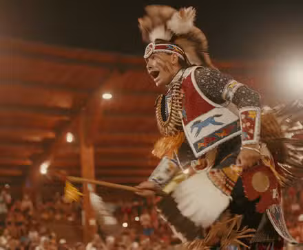 Julian Brave Noisecat dancing at the Kamloopa Powwow in Sugarcane