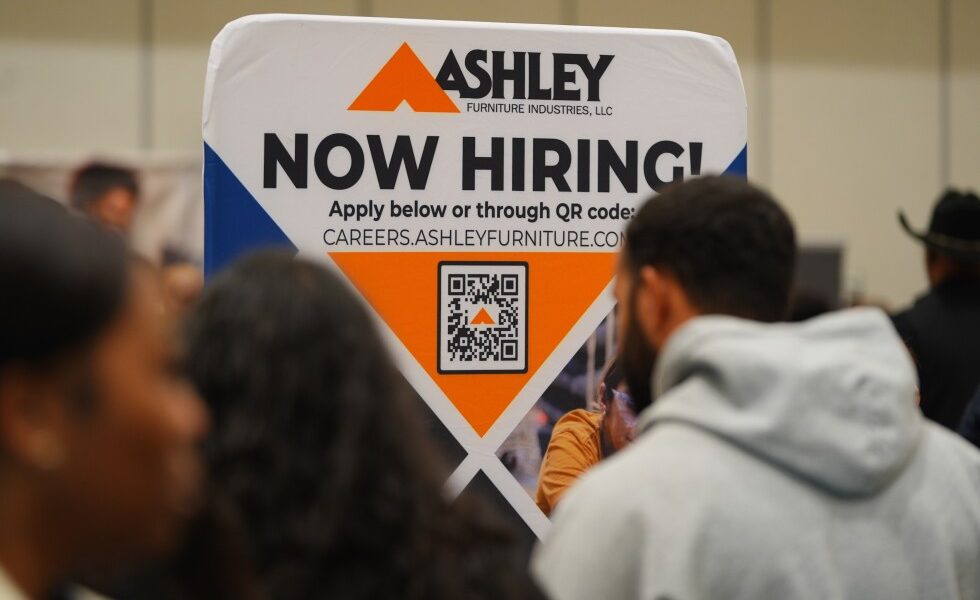 Jobless claims dip again, keeping US layoffs in a healthy range