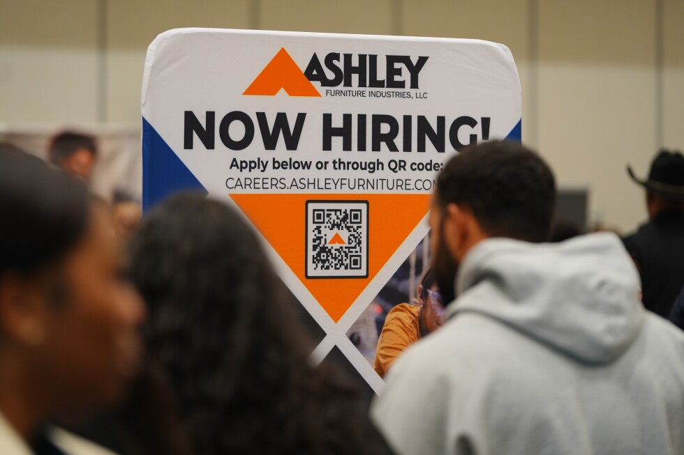 Jobless claims dip again, keeping US layoffs in a healthy range