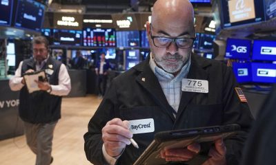 World shares mostly advance and gold declines