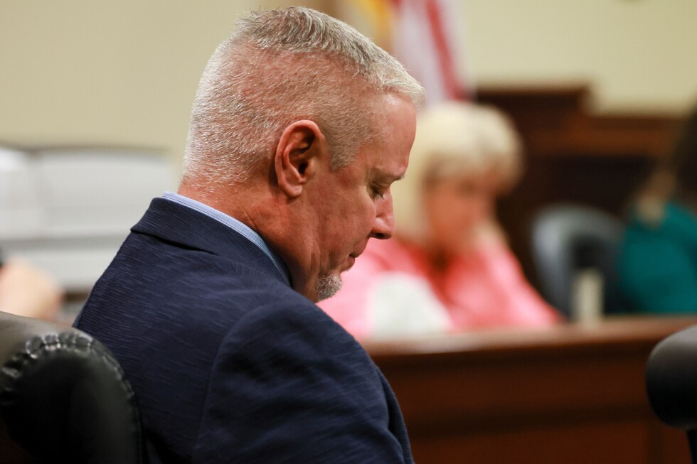 Trial gets underway for a man whose son is accused in high school shooting