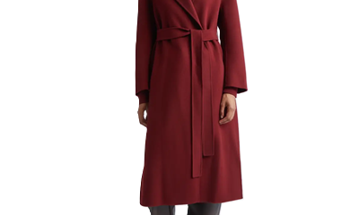 Black woman wears red winter coat that hits below her knees