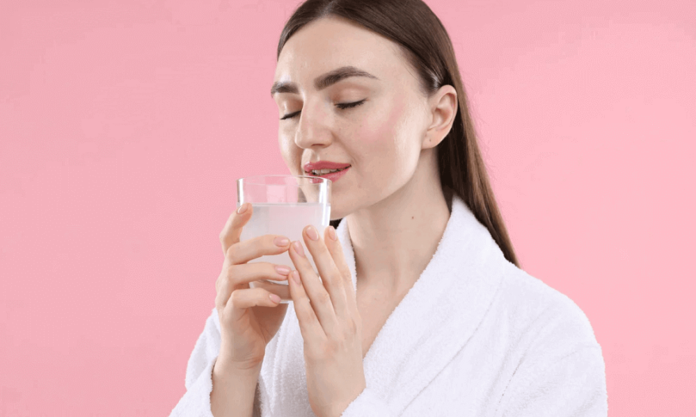 woman drinking hydrolized collagen powder