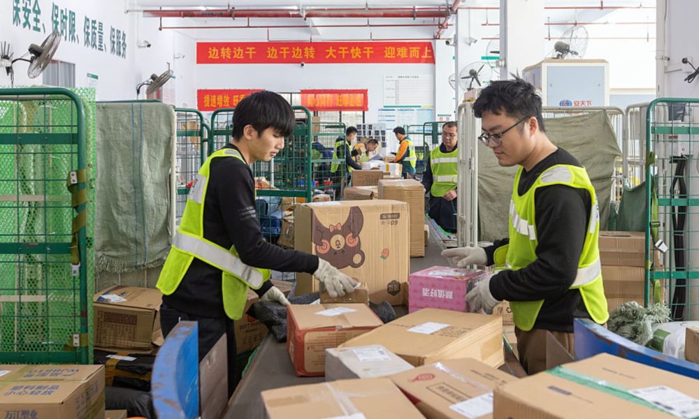 China's factory output and consumption beat forecasts, while property investment contraction slows