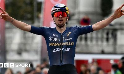 Tom Pidcock celebrates as he crosses the finish line to win the 2026 Milano-Torino race