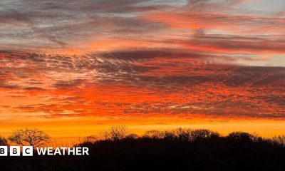 A red and yellow sunset lights up the rural landscape across south-east England.