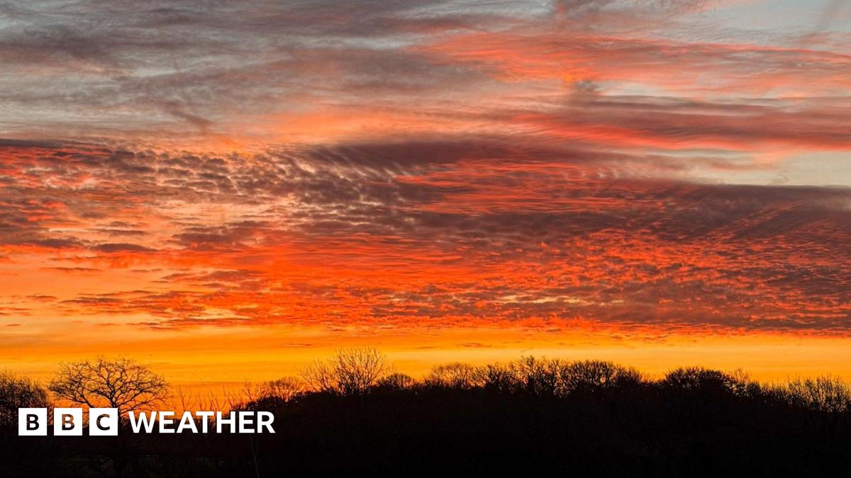 A red and yellow sunset lights up the rural landscape across south-east England.