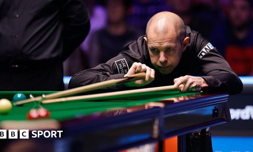 Barry Hawkins in action at the Welsh Open, lining up a shot