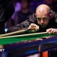 Barry Hawkins in action at the Welsh Open, lining up a shot