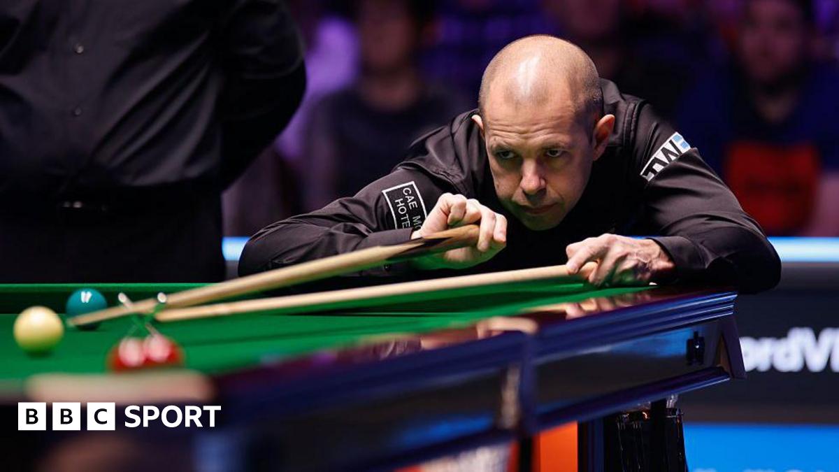 Barry Hawkins in action at the Welsh Open, lining up a shot