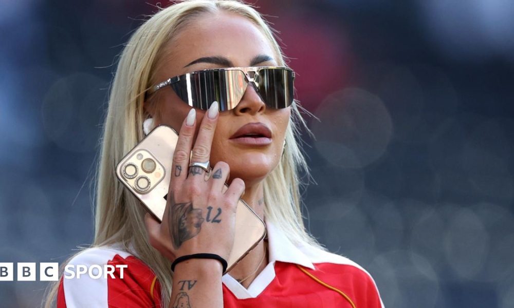 Alisha Lehmann in sunglasses and a red shirt