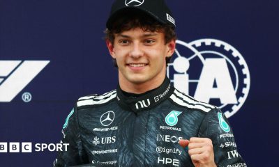 Kimi Antonelli is presented with his pole position award by Japanese sumo wrestler Kotozakura Masakatsu II