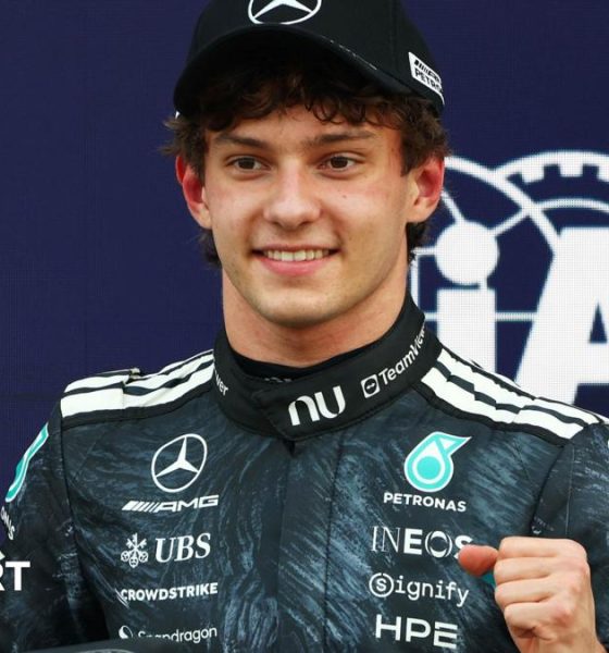 Kimi Antonelli is presented with his pole position award by Japanese sumo wrestler Kotozakura Masakatsu II