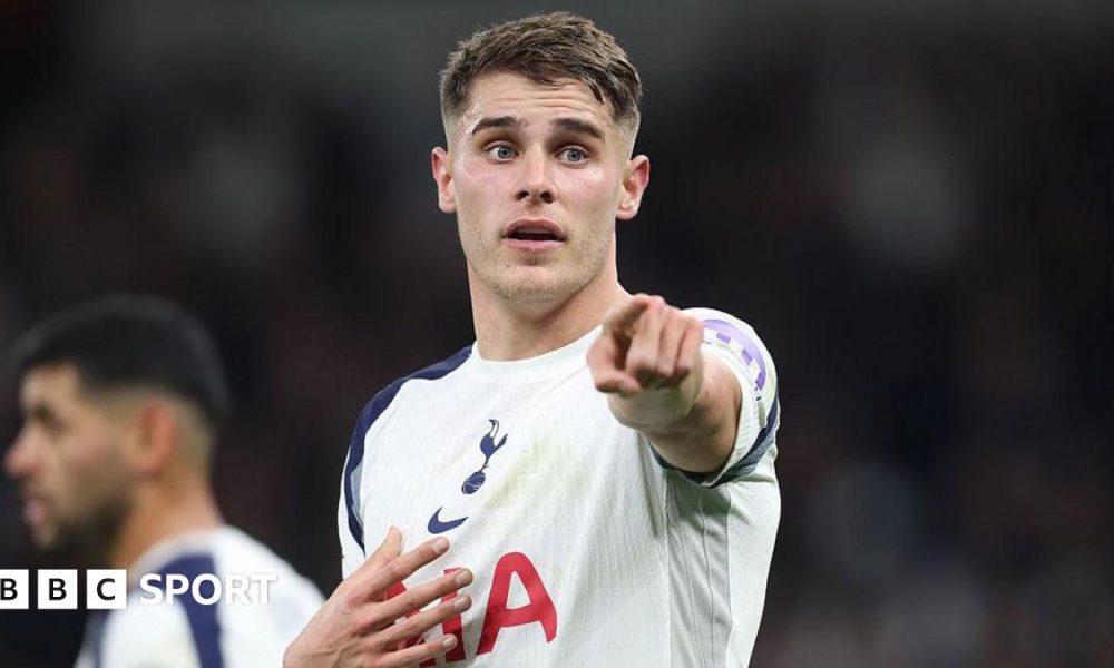 Micky van de Ven points at his team-mates while playing for Tottenham in a Champions League game