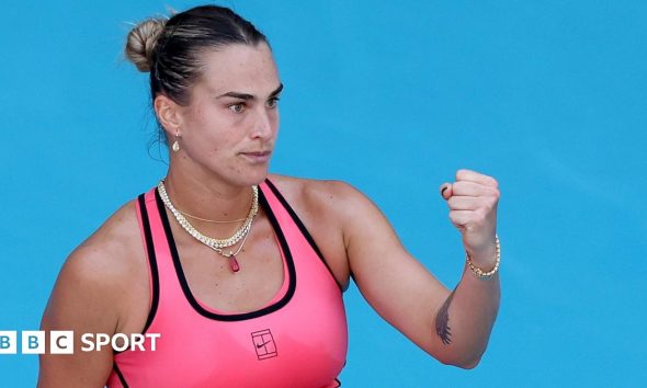 Aryna Sabalenka celebrates winning a point with a clenched fist