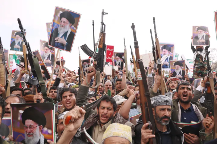 Houthi supporters raise posters of the late Iranian Supreme Leader Ayatollah Ali Khamenei as they chant slogans against Israel and the United States during a rally in Sanaa, Yemen, Sunday, March 1, 2026.