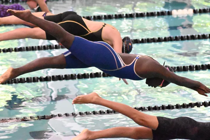 The author's daughter, Zuri, diving in a competition