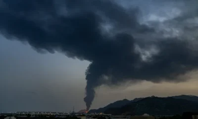 Fire and a plume of smoke is visible after, according to authorities, debris of an Iranian intercepted drone hit the Fujairah oil facility, in Fujairah, United Arab Emirates, March 3, 2026.