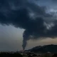 Fire and a plume of smoke is visible after, according to authorities, debris of an Iranian intercepted drone hit the Fujairah oil facility, in Fujairah, United Arab Emirates, March 3, 2026.