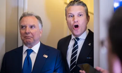 Defense Secretary Pete Hegseth answers a question while traveling on Air Force One on March 7, 2026.