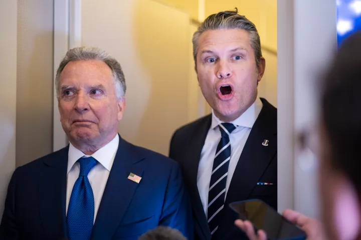 Defense Secretary Pete Hegseth answers a question while traveling on Air Force One on March 7, 2026.