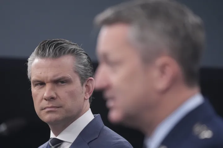 Defense Secretary Pete Hegseth and Chairman of the Joint Chiefs of Staff Gen. Dan Caine speak to members of the media during a press briefing at the Pentagon in Washington on March 19.
