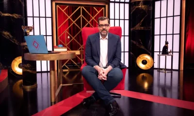 Richard Osman in his iconic House Of Games big red chair