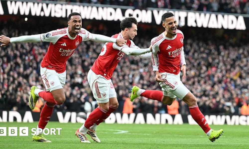 Arsenal players celebrate their goal