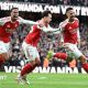 Arsenal players celebrate their goal