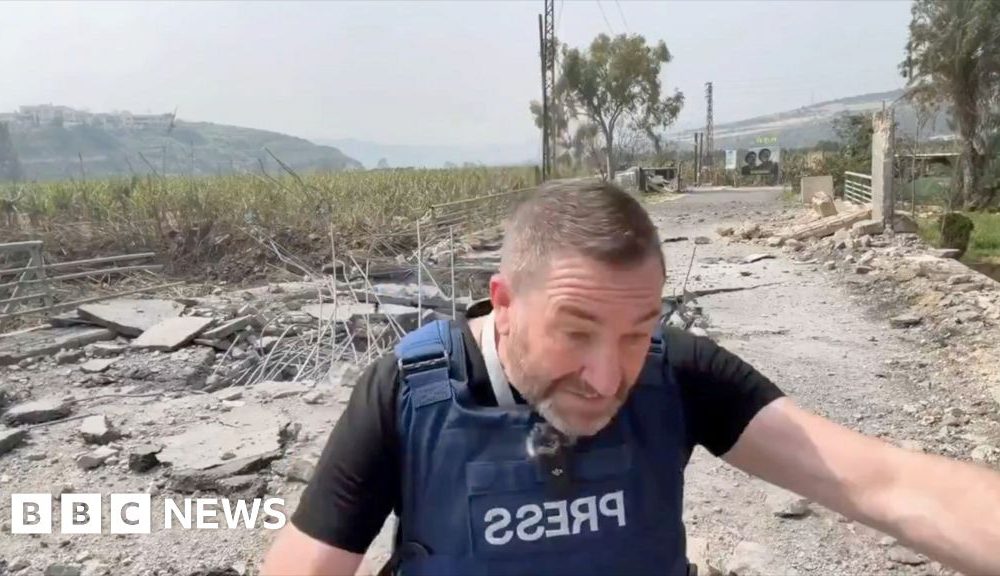 Missile lands next to presenter during live report